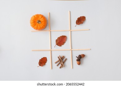 Tic Tac Toe game made of leaf, oak nut and pumpkin. Autumn xo game. 