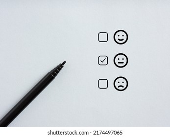 Tick placed in checkbox of selected neutral emoticon. Customer satisfaction and neutral client feedback for mediocre service concept.