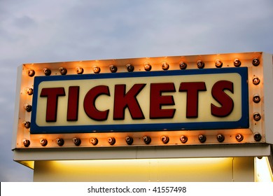 Ticket Booth Sign Illuminated At Twilight