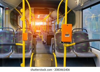 ฺBus Ticket Card Holder Of Fare In The Bus  No Passengers With Seat ,handrail And Sunlight Background.Focus At The Orange Bax.