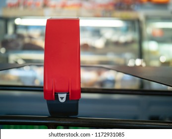 Ticket Dispenser Sitting In Front Of Line At A Local Deli Counter With Some Copy Space To Right