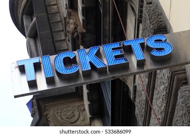 Tickets sign on a street of city