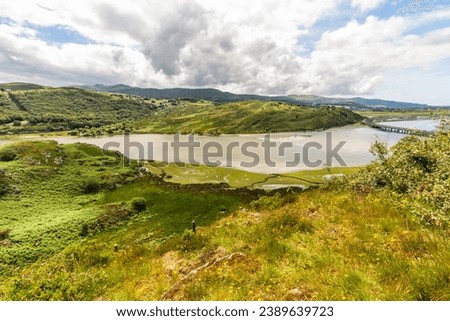The tidal afon or river Drywyd and the Pont Briwet Bridge. Penrhyndeudraeth, Eryri or Snowdonia national Park, Wales, landscape, wide angle.