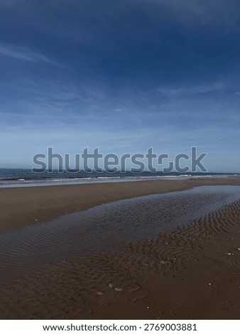 Tidal Pool Reflection on Sandy Beach at Bouctouche Dunes New Brunswick Canada