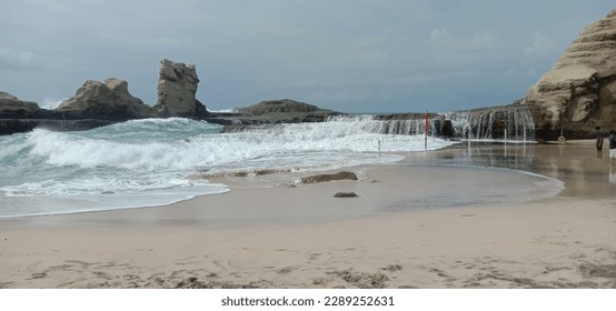 Tidal waves hitting the rocks