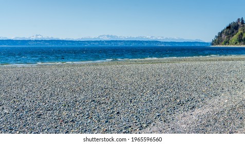 A Tide Pool In Des Moines, Washington With The Olympic Mountains In The Distance.