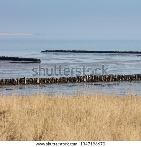 Similar – Lahnungen coastline barge