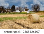 A tidy farm with white barn, a silo and white fence near Northfield, Minnesota.