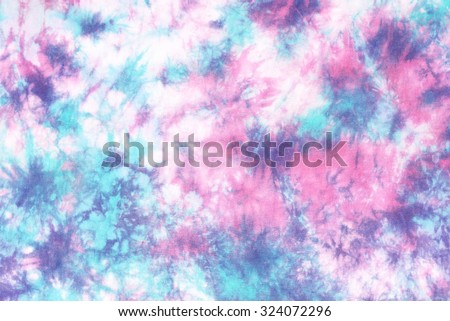 tie dye pattern hand dyed on cotton fabric background.

