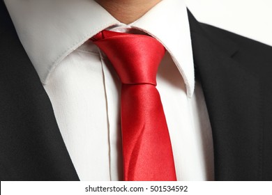 Tie A Red Tie On A Man Closeup.