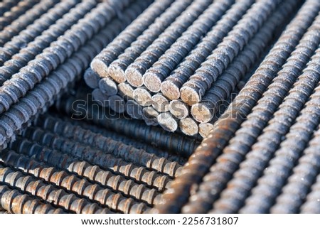 Tied iron rebar close up. Reinforced concrete structure steel bar set. Steel construction rods coated with frost. A set of reinforced steel. metal, iron background.