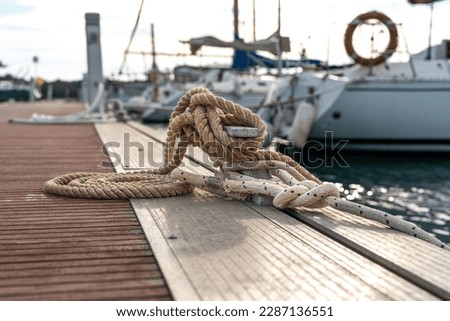 Tied up rope on a mediterranean fisherman's pier 