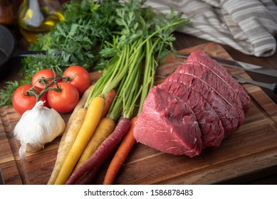 tied top round beef for roast beef with vegetable - Powered by Shutterstock