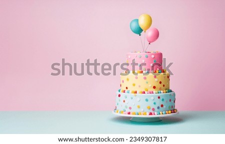 Tiered birthday cake with pastel colored tiers decorated with party balloons