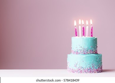 Tiered Birthday Cake With Pink Candles