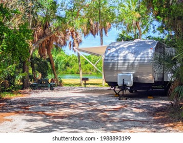 TIERRA VERDE, FLORIDA - JUNE 5, 2021:  An RV Is Camping Parked At Camp Site By Gulf Of Mexico Waters At Fort DeSoto Park Campground In Florida