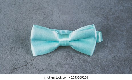 A Tiffany  Green Bow Tie Isolated On Grey Background 