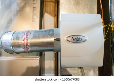 Tiffin, Iowa, USA - 2/2020:  Whole house humidifier attached to HVAC heating duct