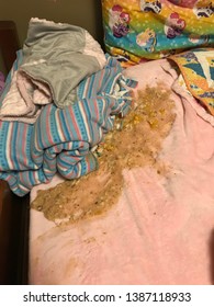 Tiffin, Iowa, USA - 4/2019: Vomit On Bed Children’s Pink Bed Sheets