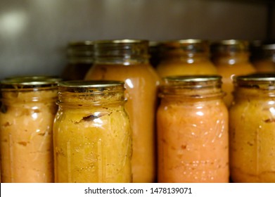 Tiffin, Iowa, USA - 7/2019: Canned Apple Sauce Preserved In Ball Glass Mason Jars