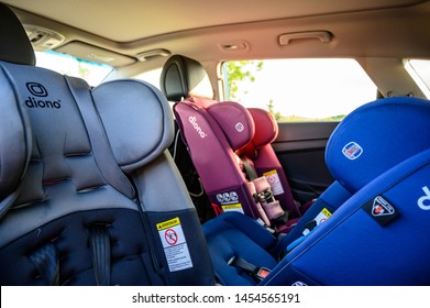 Tiffin, Iowa, USA - 7/2019: Row Of Rear And Forward Facing Diono Car Seats In Back Seat Of SUV