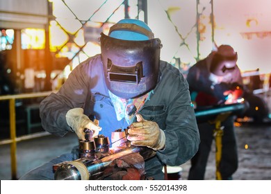 Tig welding steel pipe at workshop in factory