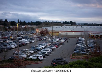 Tigard, OR, USA - Dec 23, 2021: Full Parking Lot Outside The Costco Wholesale Store In Tigard, Oregon, At Dusk On Thursday, The Day Before The Christmas Eve.