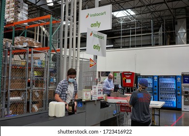 Tigard, OR, USA - May 5, 2020: The designated Instacart checkout lane in a Costco store in Tigard. Instacart and Costco have teamed up in the delivery business of grocery, home goods and prescription.