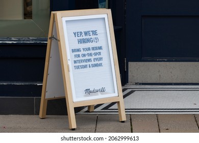 Tigard, OR, USA - Oct 6, 2021: The hiring sign at the entrance to a Madewell retail store in Tigard, Oregon. Workers left their jobs at a record pace in August, led by food and retail industries.
