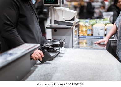 Tigard, Oregon - Oct 25, 2019 : A man waiting at checkout counter in a Costco Wholesale store