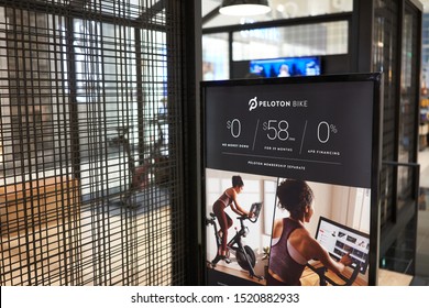 Tigard, Oregon, USA - Sep 28, 2019: Peloton Bike Monthly Payment Plan Advertisement Is Seen Outside A Peloton Showroom In Washington Square Shopping Center In Tigard.