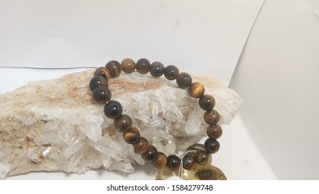 Tiger Eye Bracelet Placed On A Stone