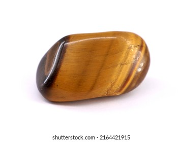 Tiger Eye Gemstone On White Background. Brown Yellowish Color.