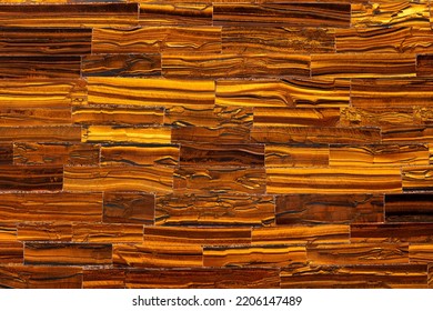 Tiger Eye Golden. Semi precious brown mineral pattern. Polished semiprecious stone for ceramic wall and floor digital tiles. Material for unique interior, exterior design. Luxury gemstone background. - Shutterstock ID 2206147489