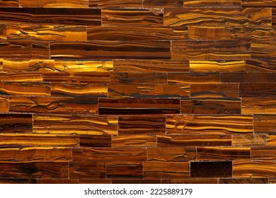 Tiger Eye Golden. Semi precious mineral pattern. Polished semiprecious stone for ceramic wall and floor digital tiles. Material for unique interior, exterior design. Luxury gemstone background. - Shutterstock ID 2225889179