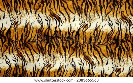 Tiger fur skin pattern. Abstract  horizontal seamless fabric background and texture. beautiful patterns, space for work, vintage wallpaper, close up.