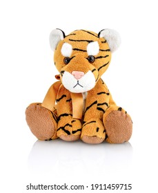 Tiger plushie doll isolated on white background with shadow reflection. Playful bright brown puppy toy. Plush stuffed puppet on white backdrop. Fluffy toy for children. Cute furry plaything for kids.