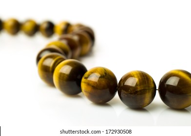 Tiger's Eye Beads Isolated On White