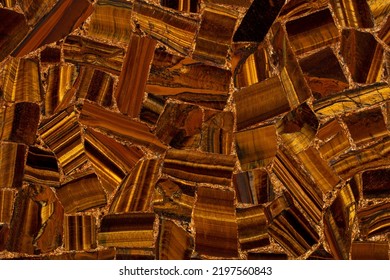 Tigers Eye Golden natural expensive semi precious brown stone texture. Semiprecious grunge stone surface close-up. Pattern for wall and floor tiles as part of luxury interior design. - Shutterstock ID 2197560843