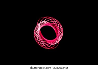 TIGHT BRIGHT RED SWIRLS OF NEON LIGHT ON A BLACK BACKGROUND