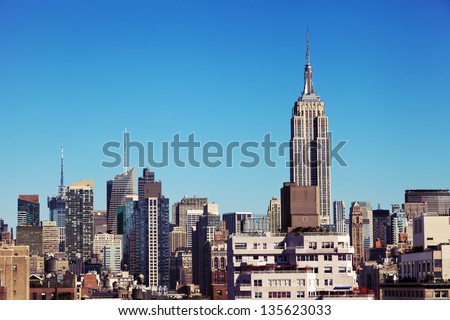 The tight cluster of skyscrapers habituating midtown Manhattan with the famous Empire State Building most prominent, as seen viewing north from the West Village.