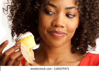 Tight Shot Of Millennial Woman Tempting To Eat Sweet Cup Cake