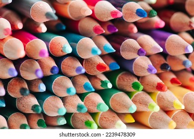 Tightly packed crayons in stack  Colored tips close up  Vibrant artistic tools 