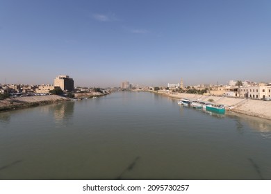 Tigris River In Central Baghdad And Buildings On Sides