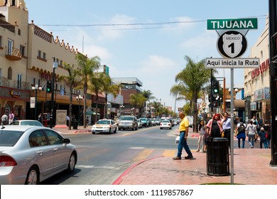 TIJUANA, BAJA CALIFORNIA/MEXICO - JUNE 20, 2018:  People Walk Along Avenida Revolucion, The City's Main Thoroughfare And A Popular Destination For Americans Traveling South Of The San Diego Border.