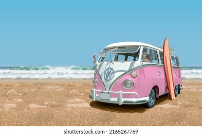 Tijuana - Mexico – July 16, 2019: Calssic 1966 Volkswagen Bus with surfboard front view at the beach with sea and blue sky in the background.