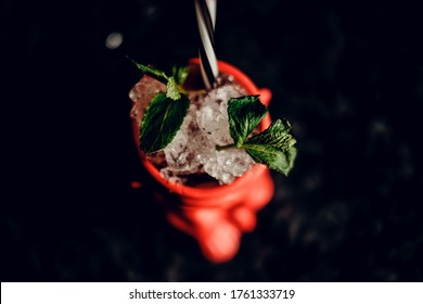 Tiki Cocktail With Mint In A Beautiful State On A Dark Background. Top View