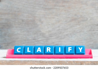 Tile alphabet letter with word clarify in red color rack on wood background - Shutterstock ID 2209507653