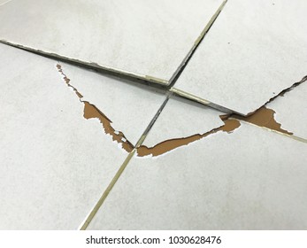 Tile Floor Exploded And Cracked Because Used For A Long Time