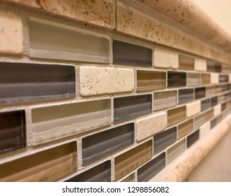 Tile Floor And Wall Kitchen Backsplash Tiles. Glass, Porcelain And Mud Installed Tiles As Decoration Of The Bathroom Walls. Home Interior Design With Worm Tile Flooring. 